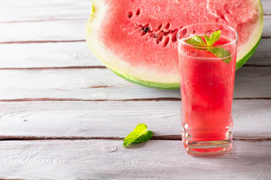 Watermelon smoothie with ice cube and mint