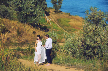 Young romantic couple during the wedding walk in nature. the bride and groom