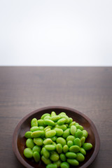 Japan pigeon pea or Edamame or Soybeans on wooden table with area for typography