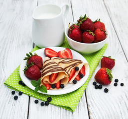 crepes with strawberries and chocolate sauce