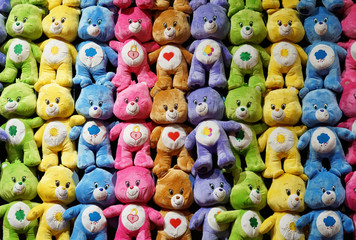 Colorful bears hanging on the wall as prize in carnival