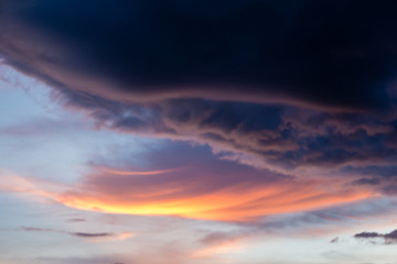 Rain cloud in the orange sky before heavy rain.