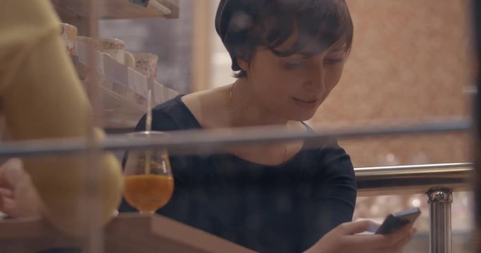 Woman Cannot Interrupt Her Mobile Communication During The Meeting With Friend In Cafe