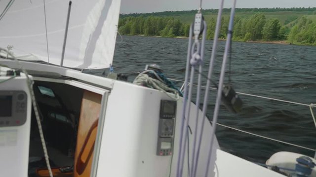 Slow motion of river-bank and water astern
