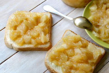 Homemade apple jam on bread. Sandwiches with bread and apple  marmalade.