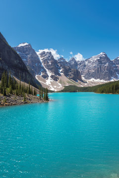 Beautiful turquoise waters of the Moraine lake with snow-covered peaks in Banff National Parkб Canada.