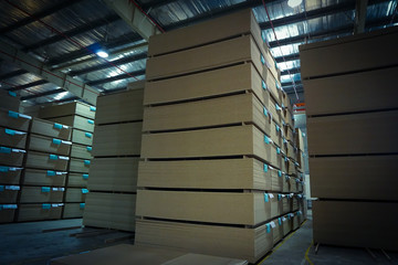 Stacks of Particle board inside factory: waiting for final process
