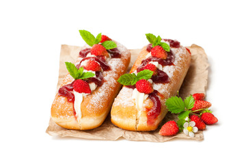 Custard  filled doughnuts with wild strawberry isolated on white
