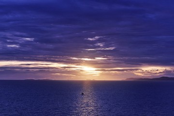 silhouette of boat and cargo ship with sunrise of landscapes