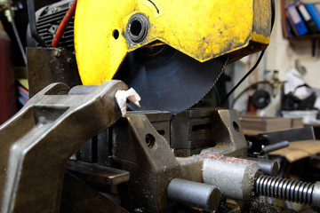 Industrial circular saw machine in a workshop