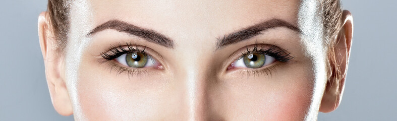 Fototapeta Closeup shot of woman eye with day makeup. Long eyelashes obraz