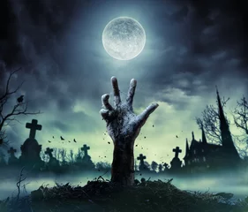 Zelfklevend Fotobehang Zombie Hand Rising Out Of A Graveyard   © Romolo Tavani