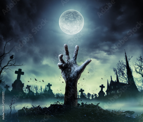 Zombie Hand Rising Out Of A Graveyard
