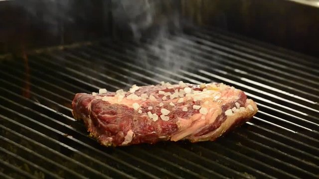 Grilling meat steak