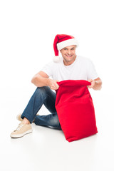 man in Santa hat with bag