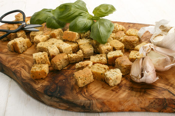 oven baked croutons on a wooden board