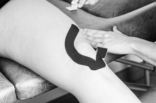 Lymphatic knee technique,  The "Y" strip. Kinesiology Tape in silhouette