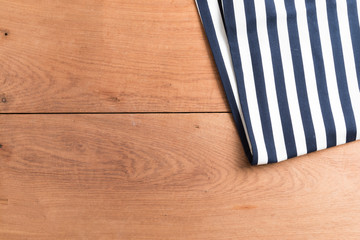 Obraz premium Tablecloths on the wooden table background