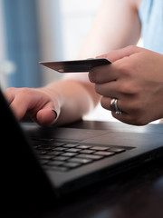 Woman paying online on internet with credit card