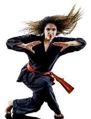Crédence de cuisine en verre imprimé Arts martiaux one caucasian woman practicing martial arts Kung Fu Pencak Silat in studio isolated on white background