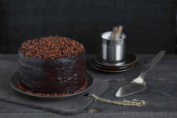 Homemade chocolate cake on the brown wooden table