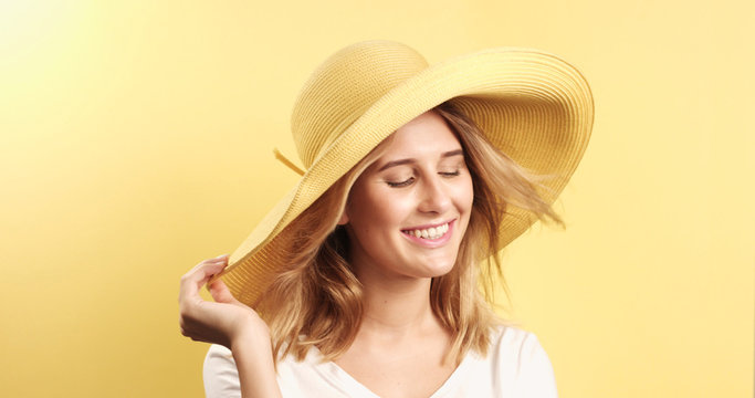 Smiling blonde woman wearing hat
