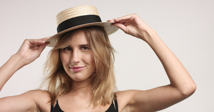 Pretty blond girl in straw hat