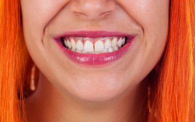 Beautiful smile of a redhead woman