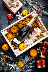 New Year's champagne and tangerines in box top view