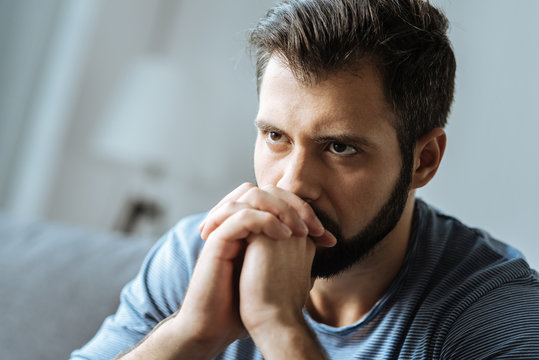 Cheerless thoughtful man feeling lonely