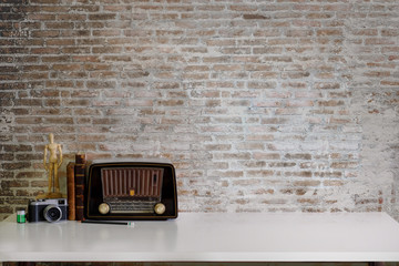 Work space Artist or designer Mock up : Desk work  or tabletop with vintage books, vintage radio and camera. desk with copy space for products display montage. - obrazy, fototapety, plakaty