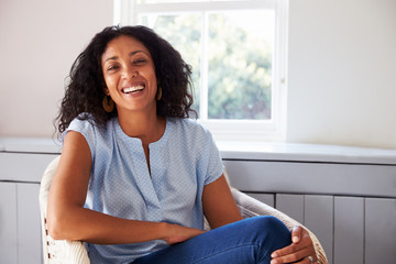 Portrait Of Woman Sitting In Chair At Home - Powered by Adobe