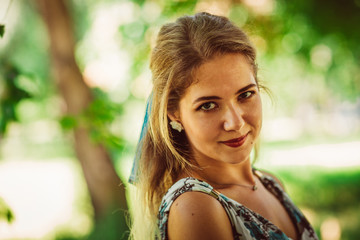 Young beautiful girl in floral dress