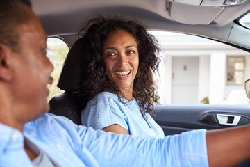Mature Couple Sitting In Car On Road Trip