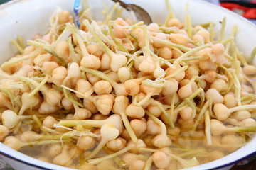 preserved garlic in big bowl at market.