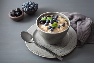 healthy breakfast steel cut oatmeal porridge with blueberry blackberry