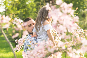 father and baby on arms