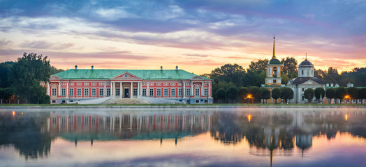 Panorama of Kuskovo estate with reflection in water on sunrise in Moscow, Russia - obrazy, fototapety, plakaty