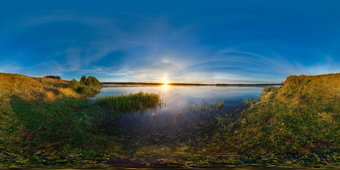 3D spherical panorama with 360 viewing angle. Ready for virtual reality or VR. Full equirectangular projection. Sunrise at the bank of lake. Deep blue sky.