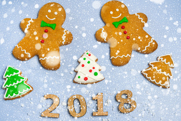 Fototapeta na wymiar New Year card Inscription Happy new year 2018 on the background of snow and decor