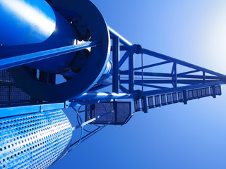 blue harbor dockside heavy crane in summer sunlight in closeup