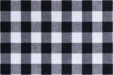 Handmade of cotton fabric of checkered pattern in black and white.