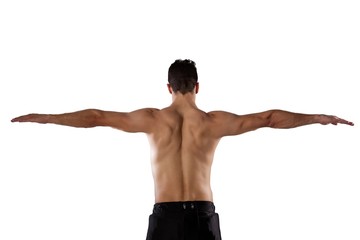 Rear view of shirtless sports player with arms outstretched