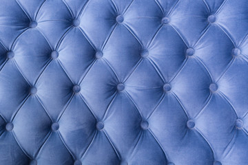 Blue fabric sofa texture with buttons for background and design.