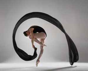 Graceful ballerina with a black veil
