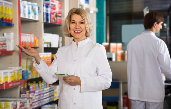 mature woman pharmacist working