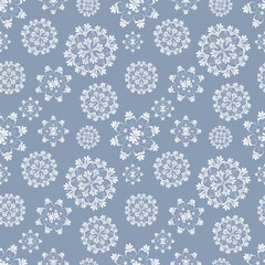 Christmas seamless pattern with white snowflakes on blue background. vector illustration.