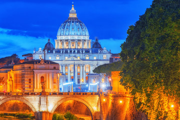 Obraz na płótnie Canvas View on Bridge Vittorio Emanuele II (Ponte Vittorio Emanuele II) and Vatican city St. Peter's Basilica (Basilica di San Pietro) at night time. Rome. Italy.