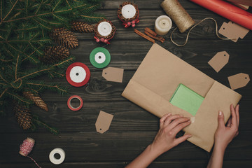 woman wrapping christmas gift