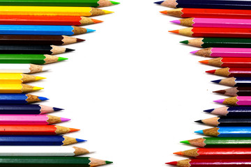color pencils on white background with space
